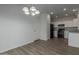 Modern kitchen with white cabinets, black appliances, and granite countertops at 812 E Agua Fria Ln, Avondale, AZ 85323