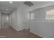 Upstairs hallway with doors to bedrooms and bathroom at 812 E Agua Fria Ln, Avondale, AZ 85323