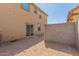 Small backyard with gravel and a block wall at 812 E Agua Fria Ln, Avondale, AZ 85323