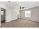 Spacious bedroom with ceiling fan and carpet flooring at 836 E Agua Fria Ln, Avondale, AZ 85323