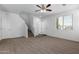 Spacious living room with carpeted floor and ceiling fan at 851 E Agua Fria Ln, Avondale, AZ 85323