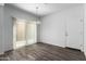 Dining area with hardwood floors and sliding glass door at 851 E Agua Fria Ln, Avondale, AZ 85323
