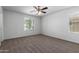 Bright bedroom with carpeted floors and ceiling fan at 851 E Agua Fria Ln, Avondale, AZ 85323