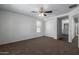 Bright bedroom with a ceiling fan and access to bathroom at 851 E Agua Fria Ln, Avondale, AZ 85323