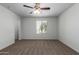Spacious bedroom with carpeted floors and ceiling fan at 851 E Agua Fria Ln, Avondale, AZ 85323