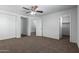 Spacious bedroom with ceiling fan and large closet at 851 E Agua Fria Ln, Avondale, AZ 85323