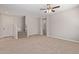 Spacious living area with stairs to upper level and powder room at 927 E Agua Fria Ln, Avondale, AZ 85323