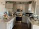 Spacious kitchen featuring granite countertops and stainless steel appliances at 1527 E Germann Rd, San Tan Valley, AZ 85140