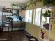 Sunlit office space with built-in shelving and large windows at 1527 E Germann Rd, San Tan Valley, AZ 85140
