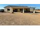 Covered patio, firepit, and spacious backyard with gravel landscaping at 1527 E Germann Rd, San Tan Valley, AZ 85140