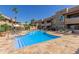 Community swimming pool with surrounding lounge chairs at 9450 E Becker Ln # 1032, Scottsdale, AZ 85260