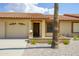 Tan colored stucco home with tile roof and a 1-car garage at 7755 E Laguna Azul Ave # 241, Mesa, AZ 85209