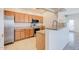 Modern kitchen with stainless steel appliances and light wood cabinets at 11500 E Cochise Dr # 2090, Scottsdale, AZ 85259