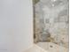 Large walk-in shower with tile surround and built-in seat at 11500 E Cochise Dr # 2090, Scottsdale, AZ 85259