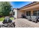 Outdoor patio with seating area and grill at 12219 W Prickly Pear Trl, Peoria, AZ 85383