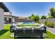 Spacious backyard with artificial turf and comfortable seating area at 2616 S Extension Rd, Mesa, AZ 85210