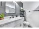 Stylish bathroom with gray shiplap walls, modern vanity, and quartz countertop at 2616 S Extension Rd, Mesa, AZ 85210