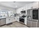 Modern kitchen with white cabinets and stainless steel appliances at 2616 S Extension Rd, Mesa, AZ 85210