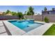 Inviting swimming pool with waterfall feature and spacious patio area at 2616 S Extension Rd, Mesa, AZ 85210