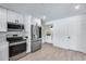 Modern kitchen with stainless steel appliances and white cabinets at 2616 S Extension Rd, Mesa, AZ 85210