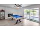 Game room featuring a pool table, fireplace, and backyard access at 2616 S Extension Rd, Mesa, AZ 85210