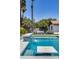 Relaxing pool area with a built in water feature and comfortable seating at 2616 S Extension Rd, Mesa, AZ 85210
