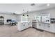 Open concept kitchen with island, pool view, and stainless steel appliances at 2616 S Extension Rd, Mesa, AZ 85210