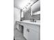 Modern bathroom with double vanity, white cabinets, and hexagon tile floor at 2616 S Extension Rd, Mesa, AZ 85210