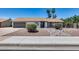 House exterior showcasing a landscaped yard and two-car garage at 2616 S Extension Rd, Mesa, AZ 85210