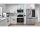 Modern kitchen with white cabinets and stainless steel appliances at 2616 S Extension Rd, Mesa, AZ 85210