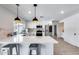 Modern kitchen with white cabinets, island, and stainless steel appliances at 2616 S Extension Rd, Mesa, AZ 85210