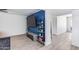 Living area with built-in shelving and large TV at 2616 S Extension Rd, Mesa, AZ 85210