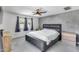 Spacious main bedroom with a gray upholstered bed and large windows at 2616 S Extension Rd, Mesa, AZ 85210