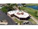 Aerial view of clubhouse with patio and golf cart parking at 26006 S Brentwood Dr, Sun Lakes, AZ 85248