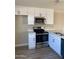 Stainless steel range and microwave in updated kitchen at 5735 E Mcdowell Rd # 208, Mesa, AZ 85215