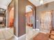 Elegant entryway with arched doorways and tile flooring at 20102 W Camelback Rd, Litchfield Park, AZ 85340