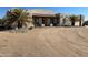 Spanish style home with front porch and desert landscaping at 20102 W Camelback Rd, Litchfield Park, AZ 85340