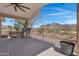 Covered deck with a view and ceiling fan at 77 S Arroya Rd, Apache Junction, AZ 85119