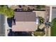 Aerial view of backyard with pool, landscaping, and palm tree at 10801 W Palm Ln, Avondale, AZ 85392