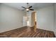 Bright bedroom with hardwood floors and ceiling fan at 10801 W Palm Ln, Avondale, AZ 85392