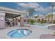 Relaxing hot tub area with seating and a covered patio at 15221 N Clubgate Dr # 2130, Scottsdale, AZ 85254