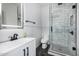 Stylish bathroom with marble tile, glass shower, and modern fixtures at 1829 W Cloud Rd, Phoenix, AZ 85086