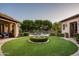 Landscaped courtyard with fountain, creating a serene and inviting outdoor space at 10207 E Diamond Rim Dr # 2121, Scottsdale, AZ 85255