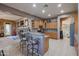 Kitchen with breakfast bar and access to living areas at 20377 W Terrace Ln, Buckeye, AZ 85396