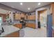 L-shaped kitchen with stainless steel appliances and granite countertops at 20377 W Terrace Ln, Buckeye, AZ 85396