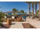 Relaxing pool area with covered seating and landscaping at 20377 W Terrace Ln, Buckeye, AZ 85396