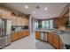 Spacious kitchen with ample cabinetry, granite countertops, and stainless steel appliances at 20377 W Terrace Ln, Buckeye, AZ 85396