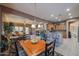 Open concept kitchen with island, breakfast nook, and views to living room at 20377 W Terrace Ln, Buckeye, AZ 85396