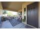 Inviting front porch with comfortable seating and a decorative rug at 20377 W Terrace Ln, Buckeye, AZ 85396