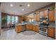 Open concept kitchen with island and stainless steel appliances at 20377 W Terrace Ln, Buckeye, AZ 85396